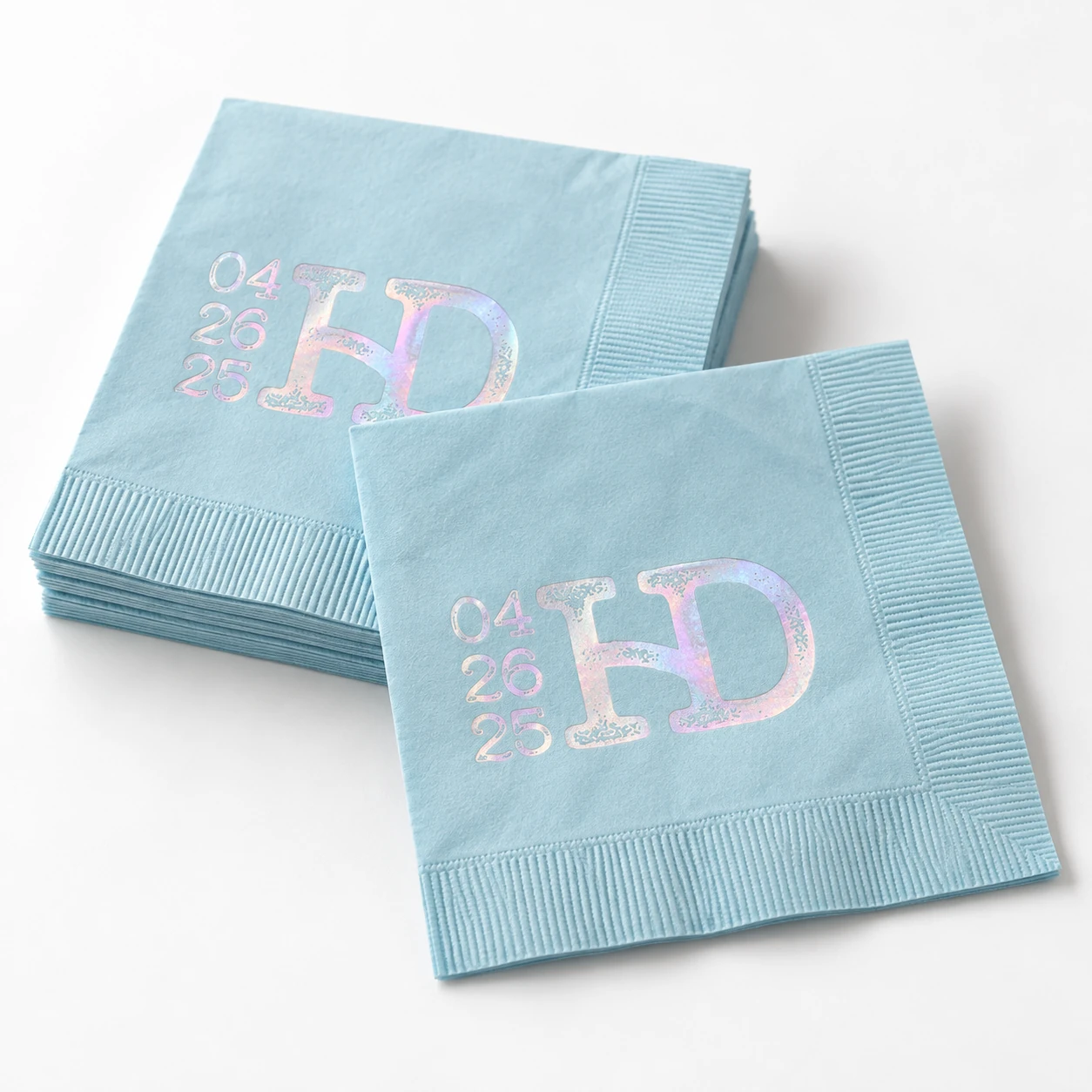 Hayden blue cocktail napkins with holographic lettering