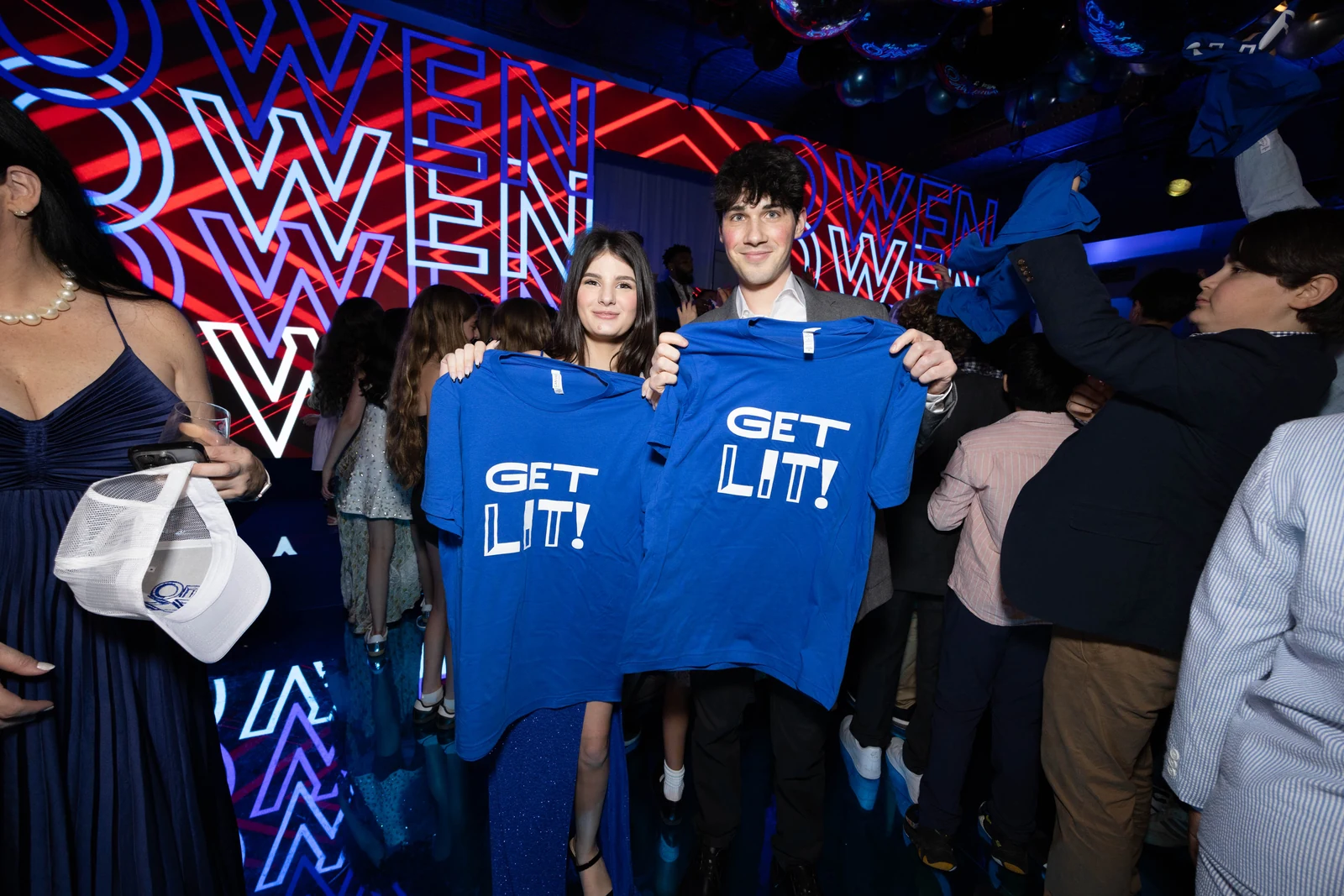 Owen’s Bar Mitzvah: Guests holding custom shirts