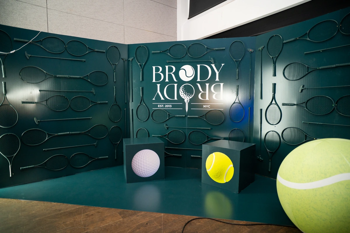Brody green racket wall and oversized sports balls