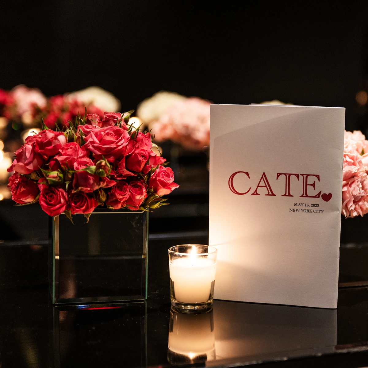 Cate red flowers, candle and printed menu