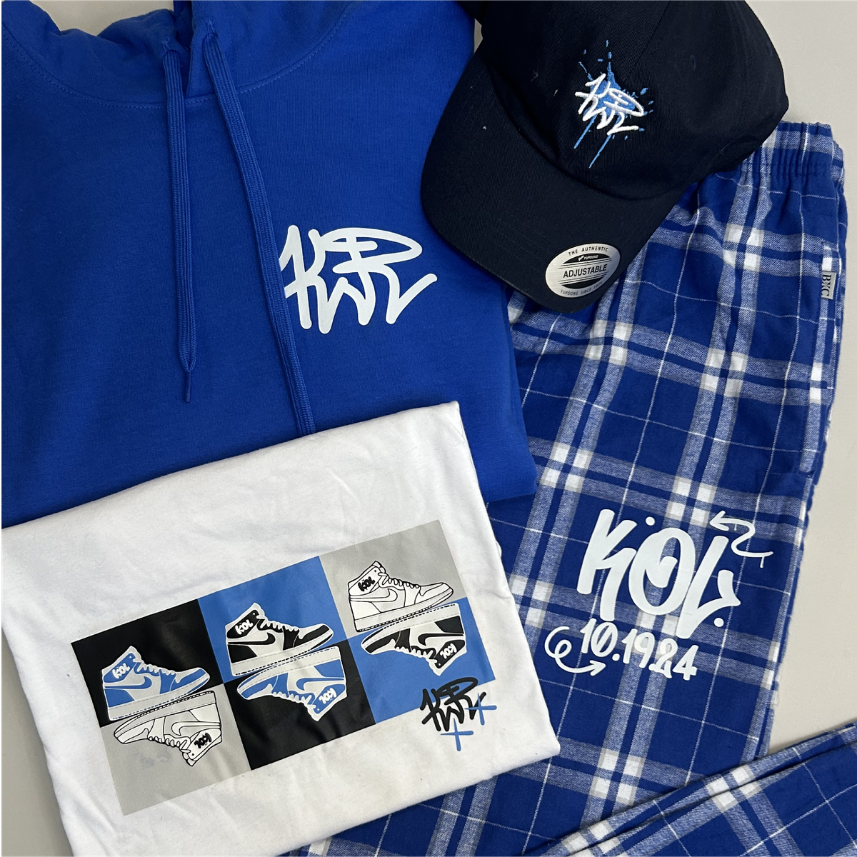Kol blue hoodie, cap, plaid pants and sneaker-print shirt