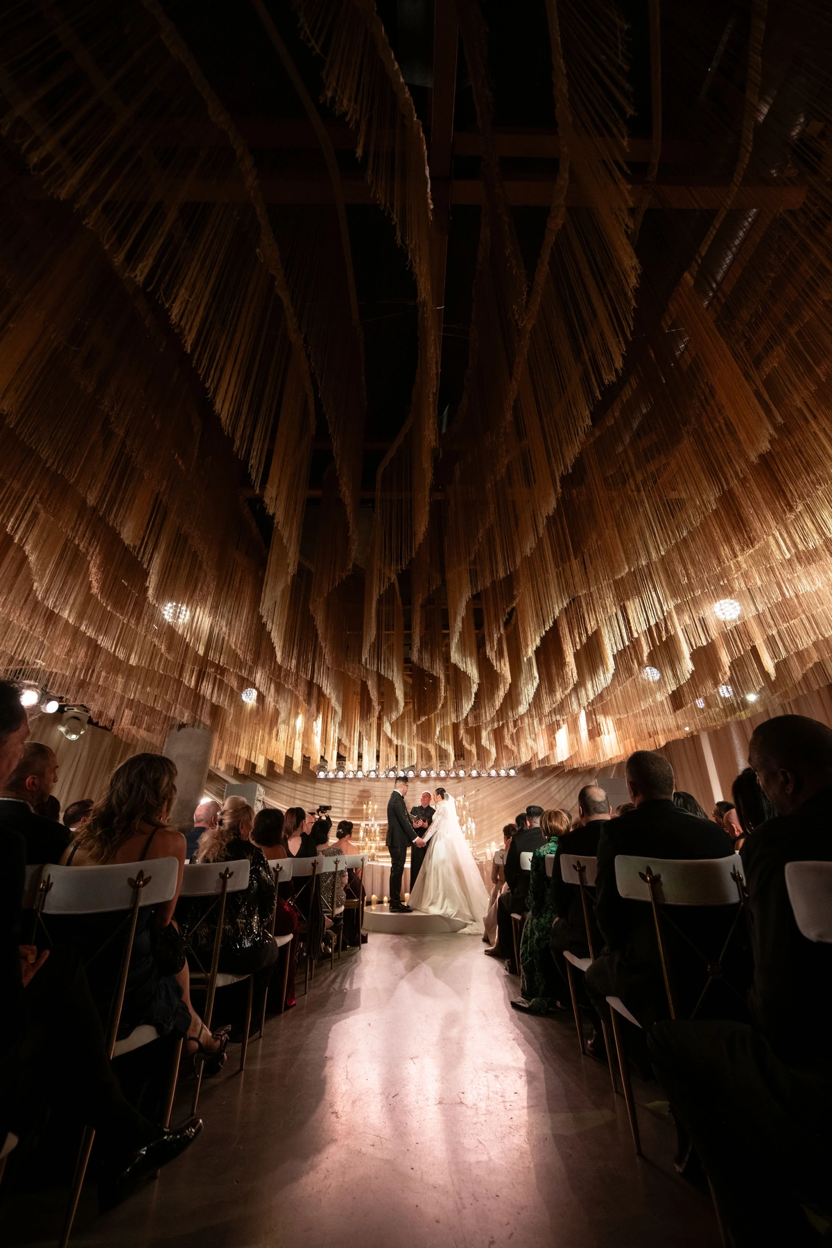 Lauren & Gerry wedding beneath hanging lights