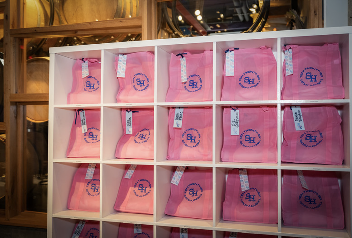 Sue pink gift bags in display cubbies