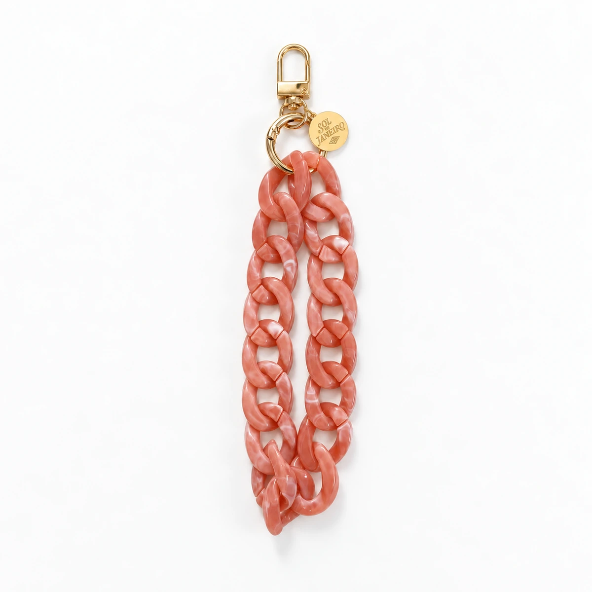 Sol de Janeiro coral chain wristlet with gold hardware