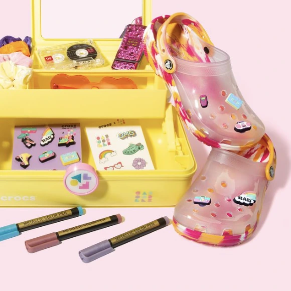 Caboodles cosmetics case with colorful charms and Crocs