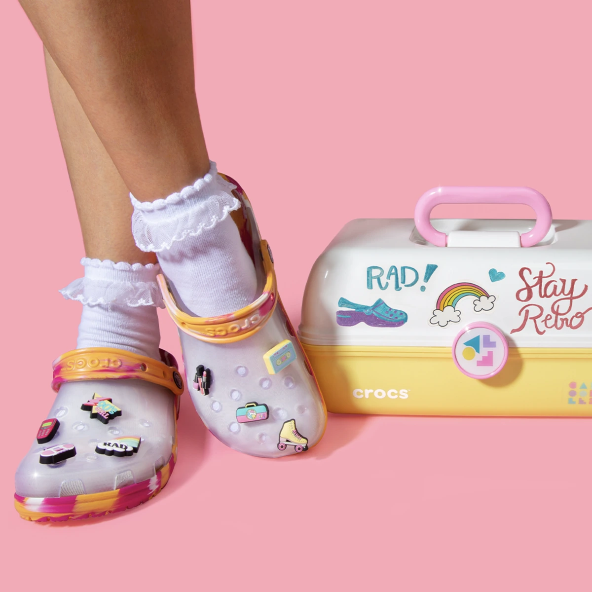 Caboodles and Crocs colorful accessory charms on pink