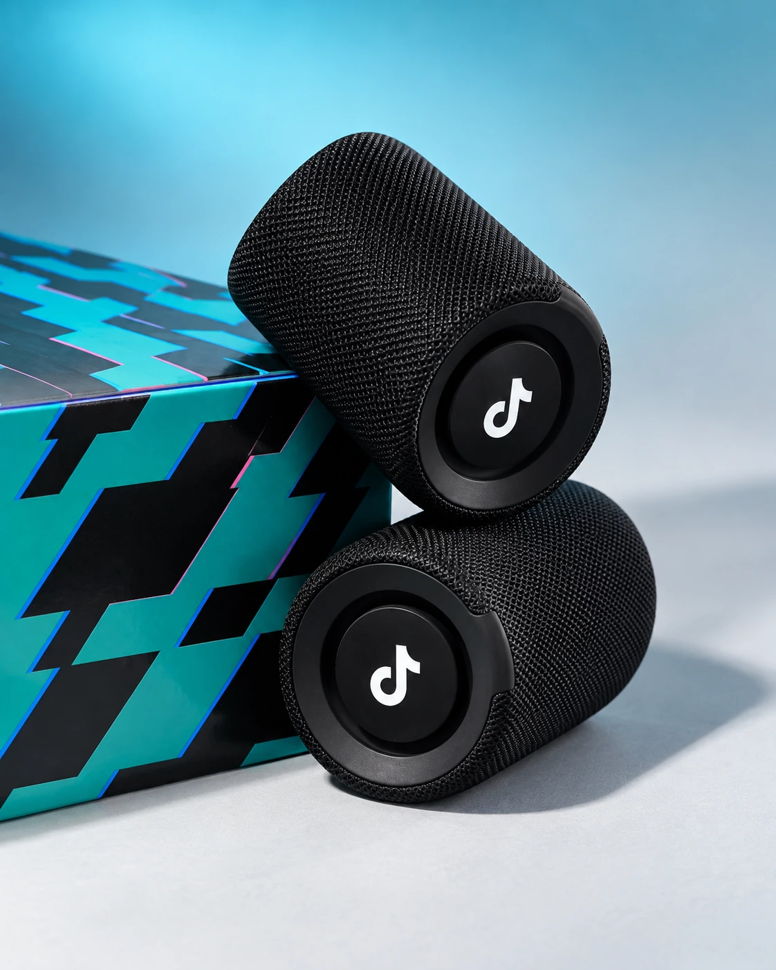 TikTok speakers with turquoise and black packaging
