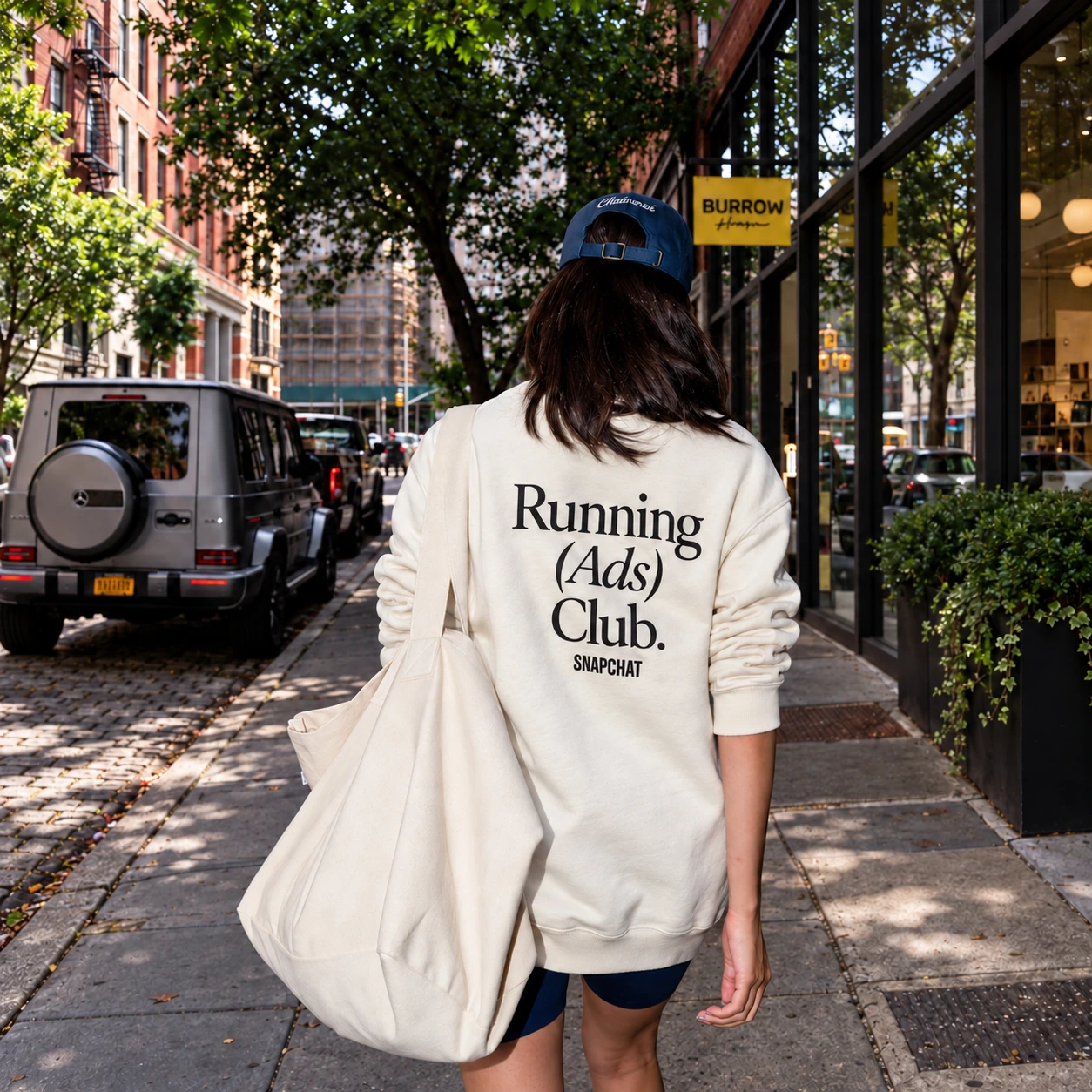 Snapchat Running (Ads) Club. crewneck styled on the street with a canvas tote